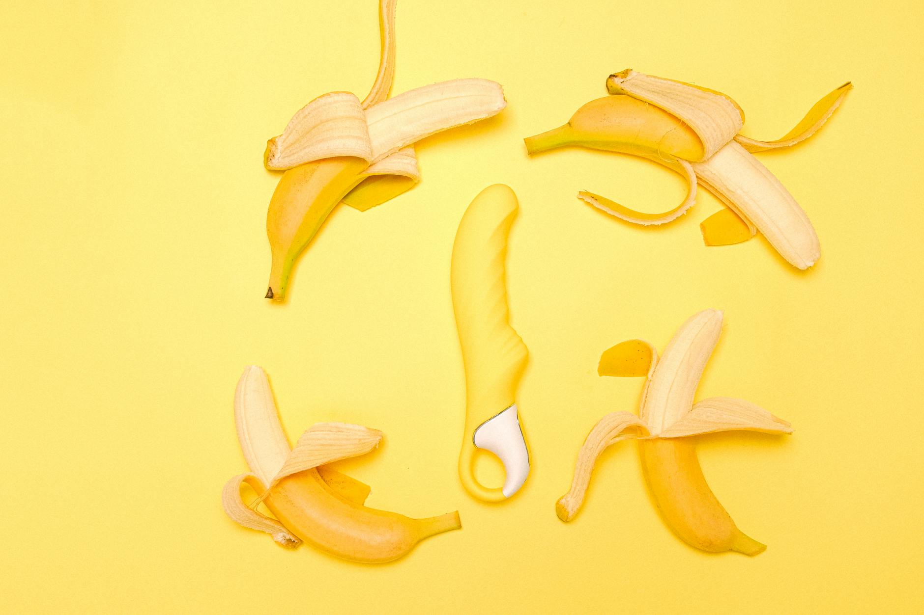 Yellow lemon vibrator on bright background symbolizing reconnection and pleasure