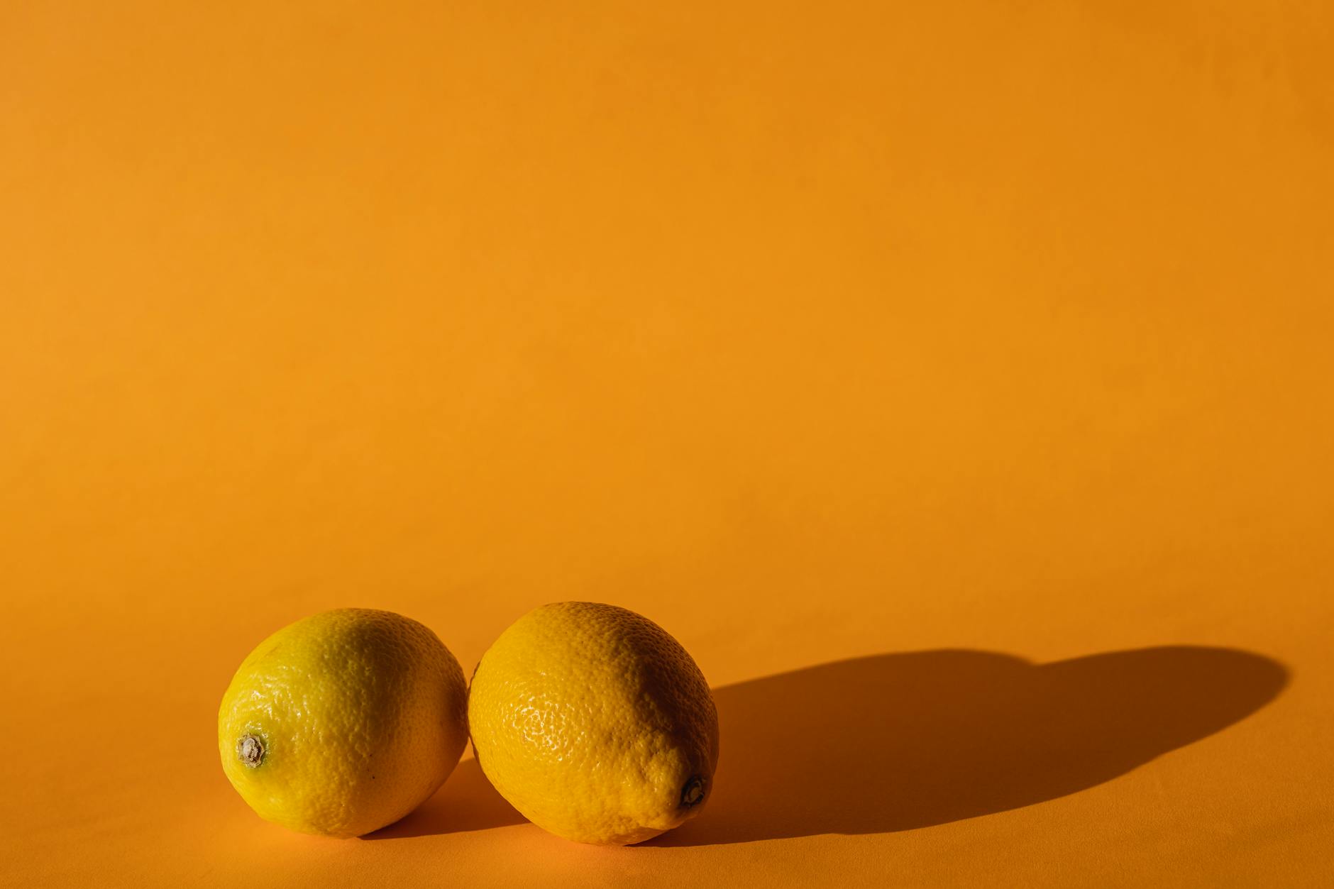 Fresh ripe yellow lemons on a bright modern background